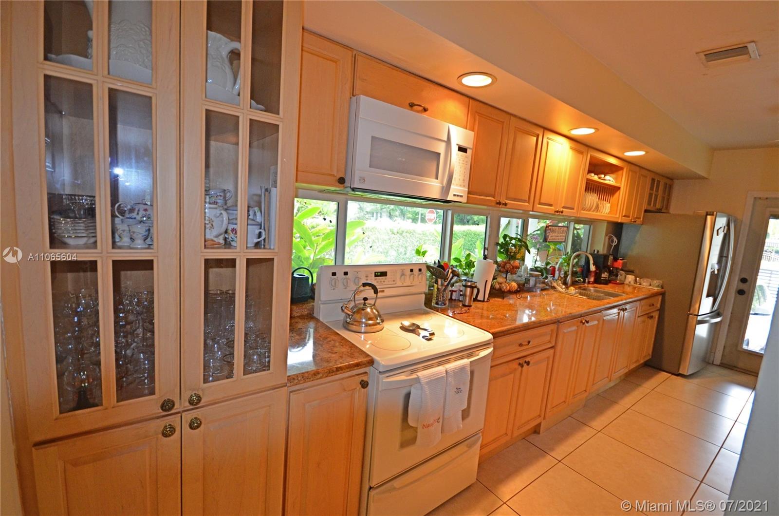 175 Southwest 24th Road Miami, FL 33129 - Photo 8 of 17 a room with multiple dryer and washer