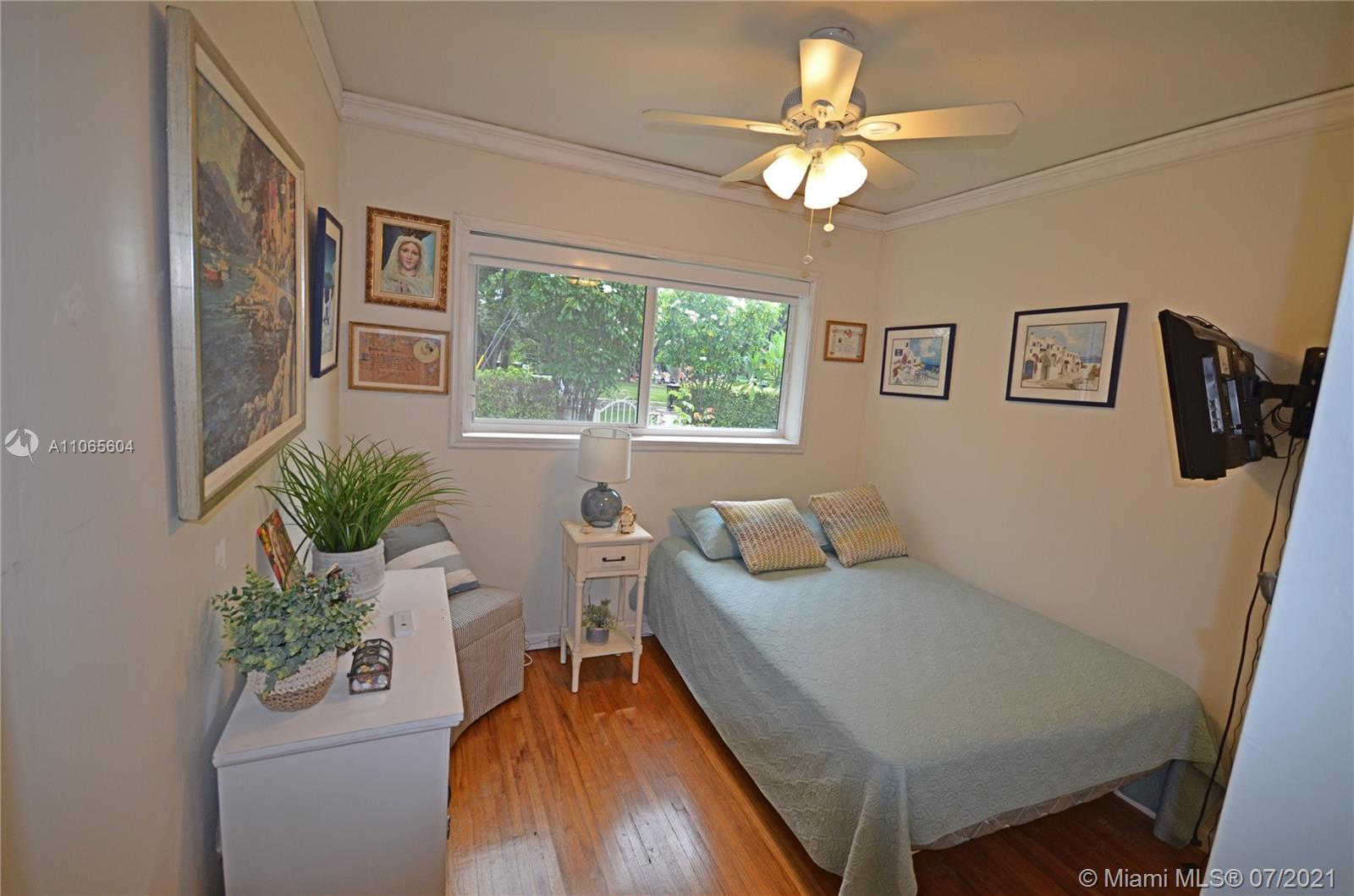 175 Southwest 24th Road Miami, FL 33129 - Photo 10 of 17 a living room with furniture and a large window