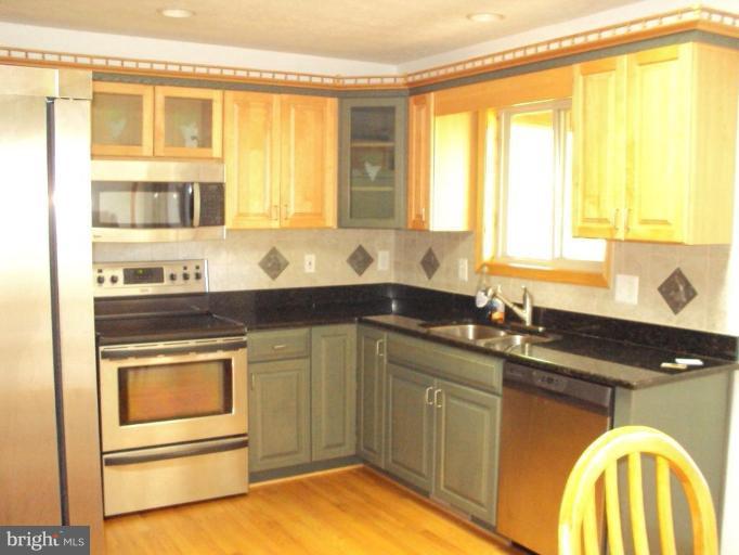 255 Mountain Top Road Front Royal, VA 22630 - Photo 13 of 30 a kitchen with a sink and a window
