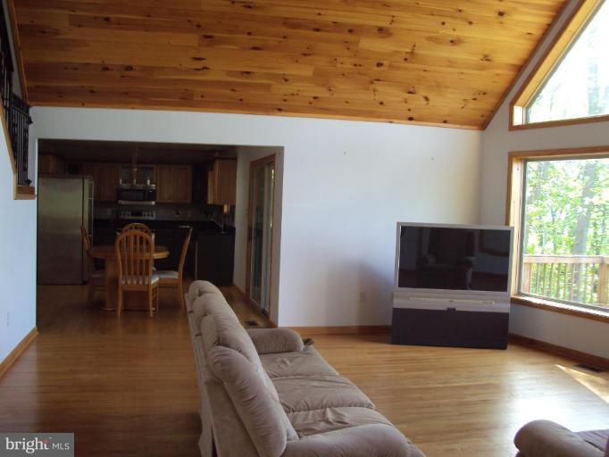 255 Mountain Top Road Front Royal, VA 22630 - Photo 15 of 30 a living room with furniture and a flat screen tv