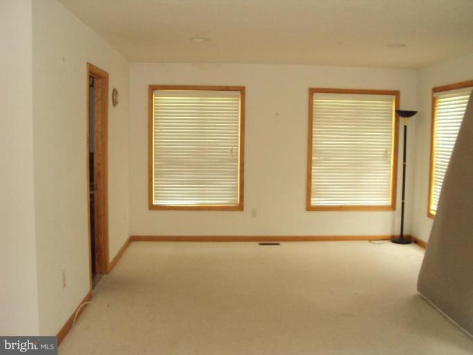 255 Mountain Top Road Front Royal, VA 22630 - Photo 17 of 30 a view of an empty room with a window