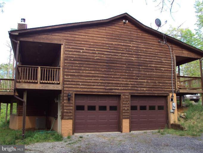 255 Mountain Top Road Front Royal, VA 22630 - Photo 5 of 30 a front view of a house with balcony