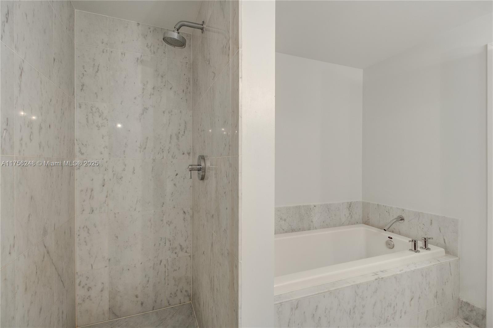 253 Northeast 2nd Street, Unit 3702 Miami, FL 33132 - Photo 22 of 25 a bath tub sitting next to a white sink