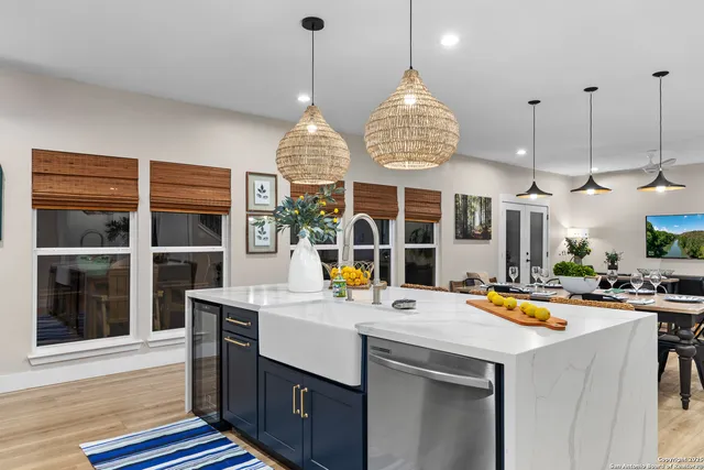 a view of hall way with furniture and chandelier