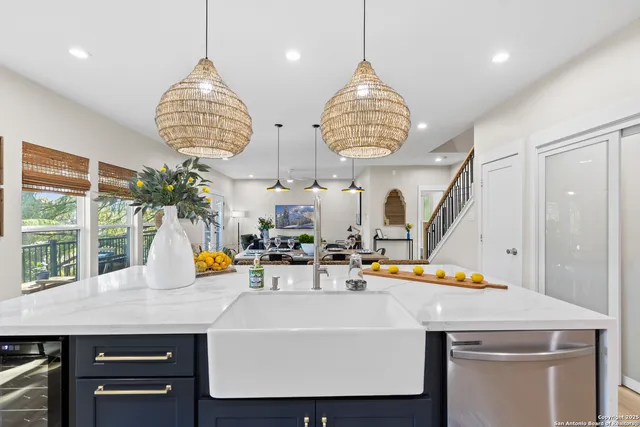a bedroom with a bed and a lamp on dresser