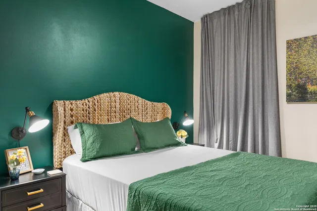 a bedroom with a bed and a dresser