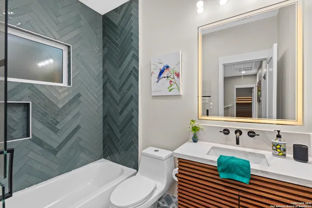 a bedroom with a bed and a couch