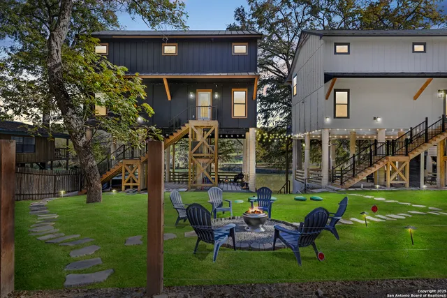 a view of a house with backyard porch and sitting area