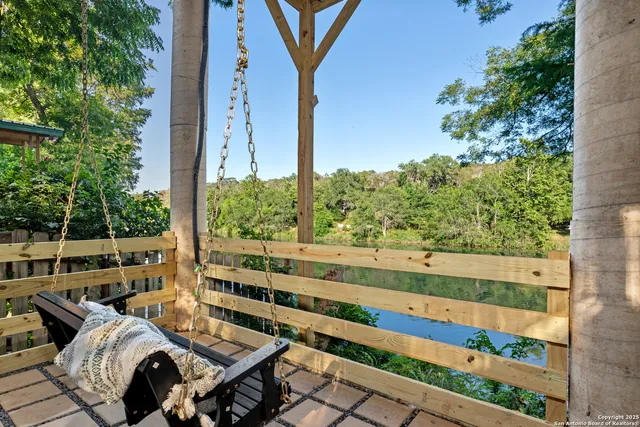 a front view of a house with plants