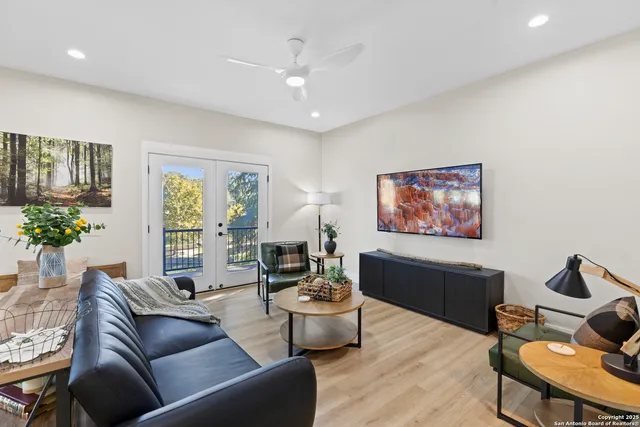 a living room with furniture and a large window