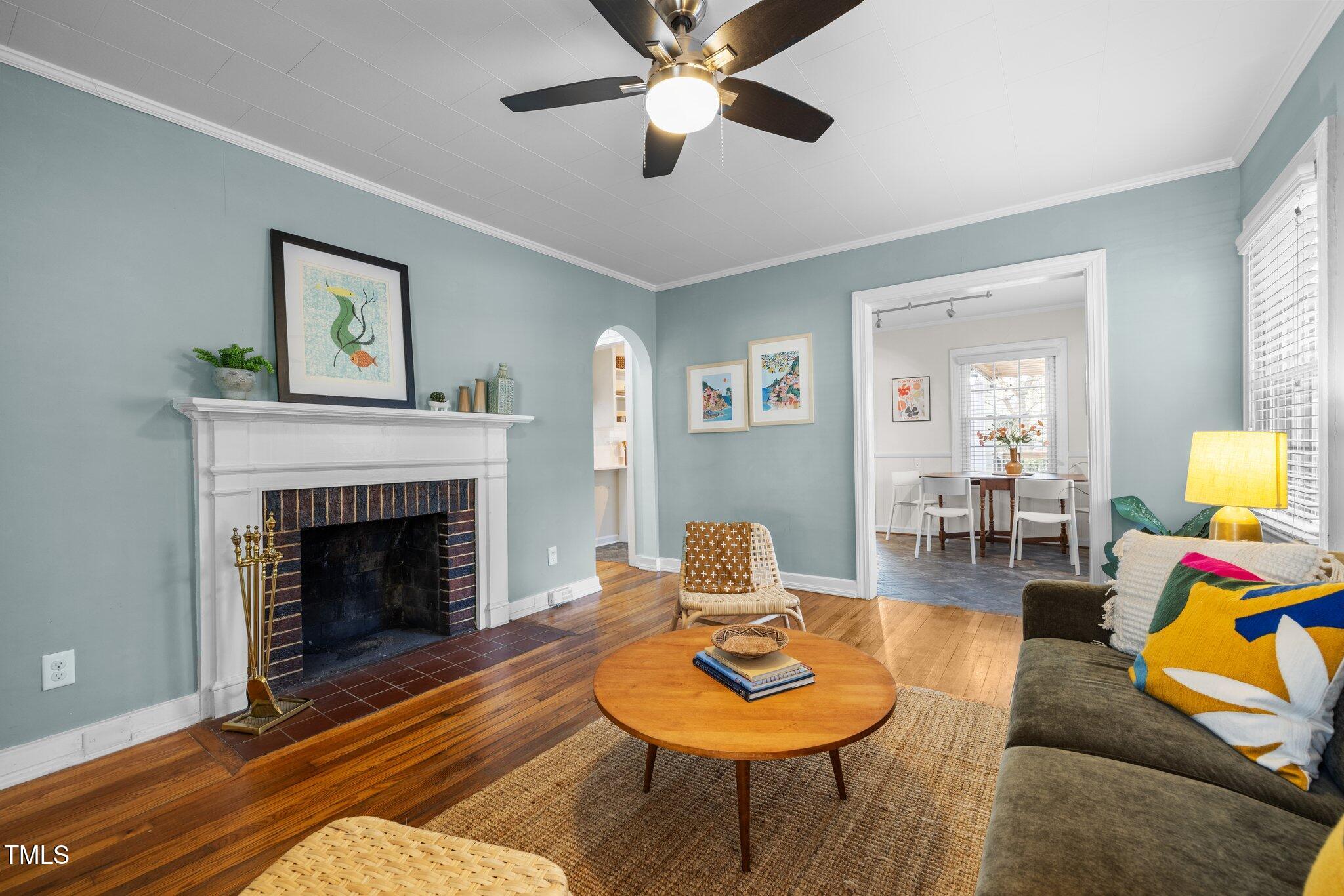 a living room with furniture and a fireplace