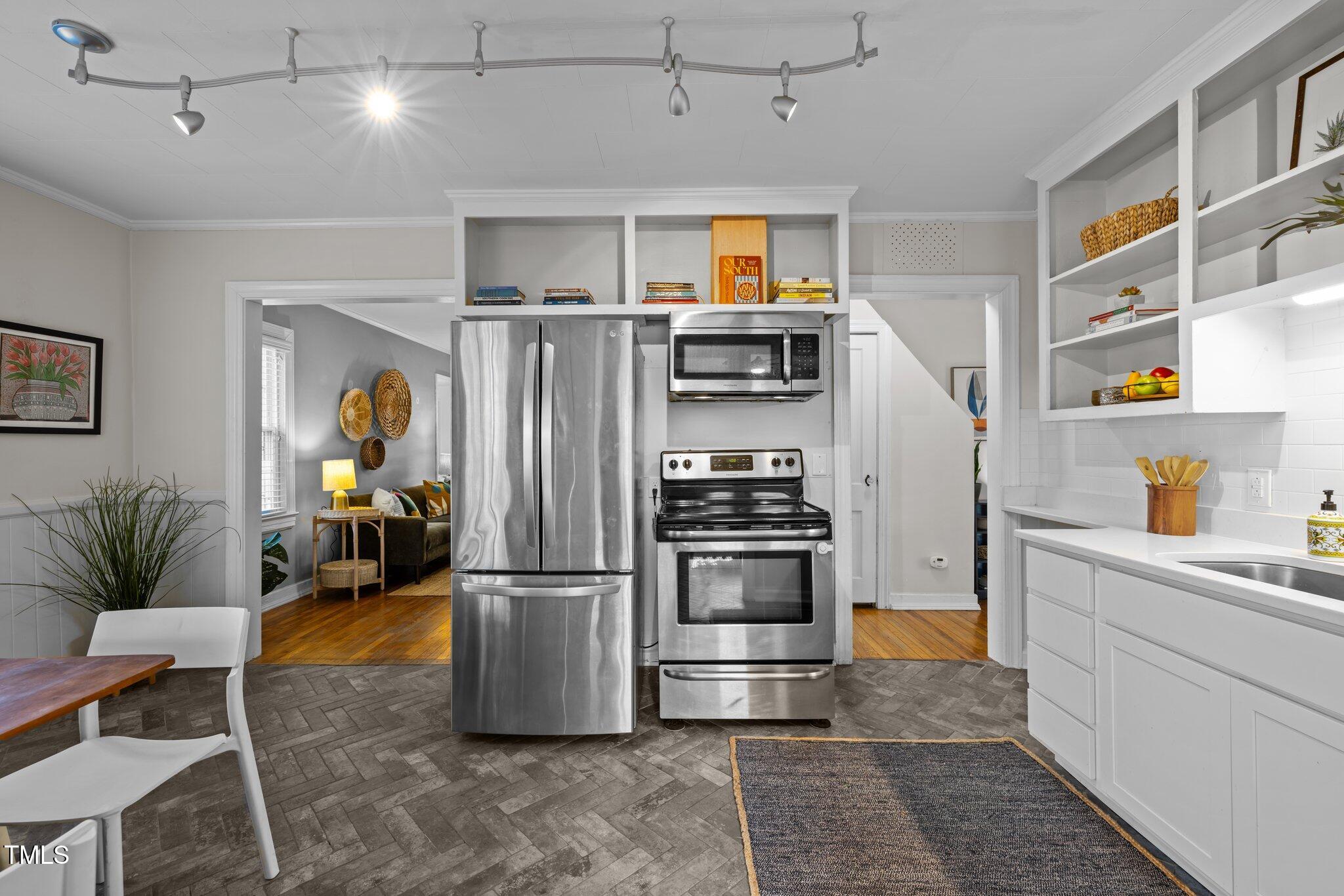 2511 State Street Durham, NC 27704 - Photo 12 of 45 a kitchen with refrigerator and car