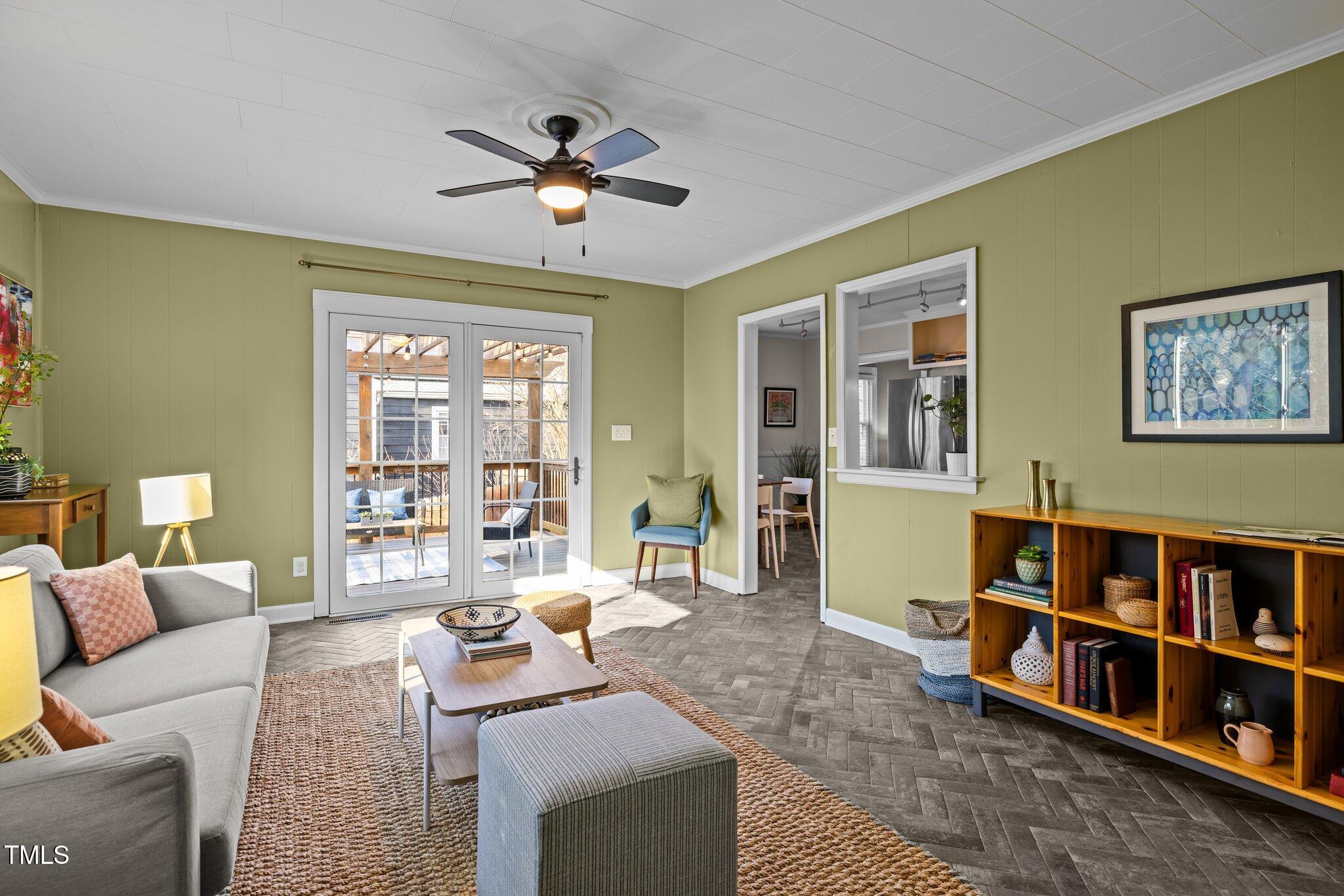 2511 State Street Durham, NC 27704 - Photo 17 of 45 a living room with furniture and a book shelf