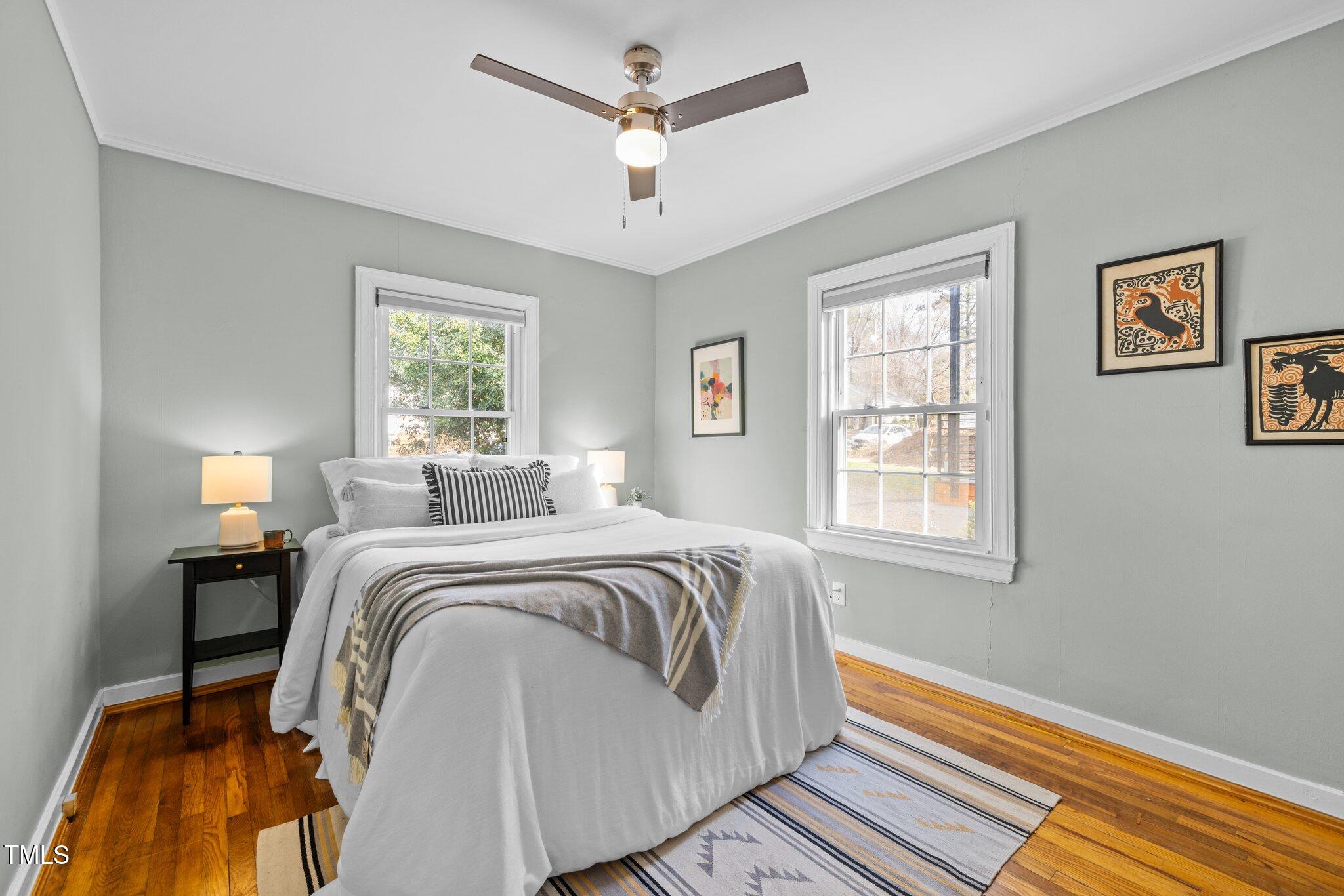 2511 State Street Durham, NC 27704 - Photo 27 of 45 a bedroom with a bed and a window