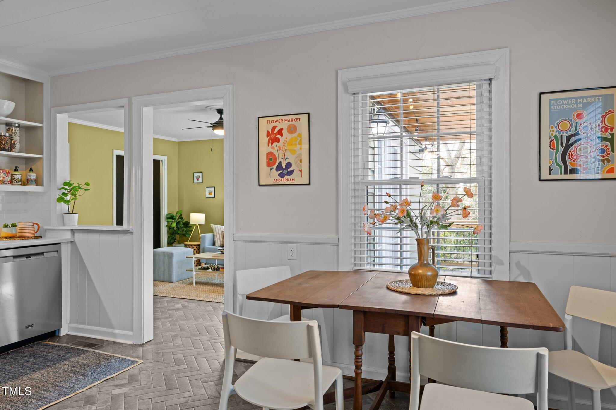 2511 State Street Durham, NC 27704 - Photo 7 of 45 a view of a dining room with furniture window and wooden floor