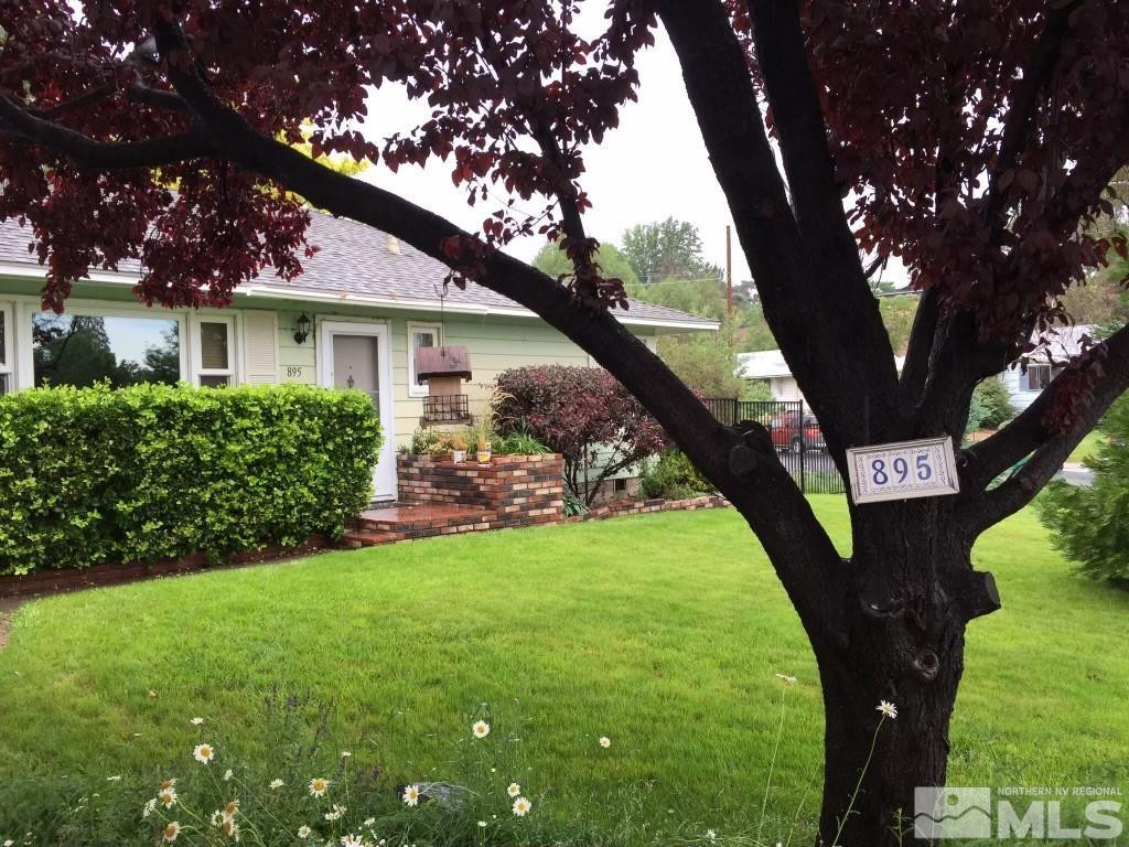 895 Lodge Avenue Reno, NV 89503 - Photo 1 of 28 a front view of a house with garden
