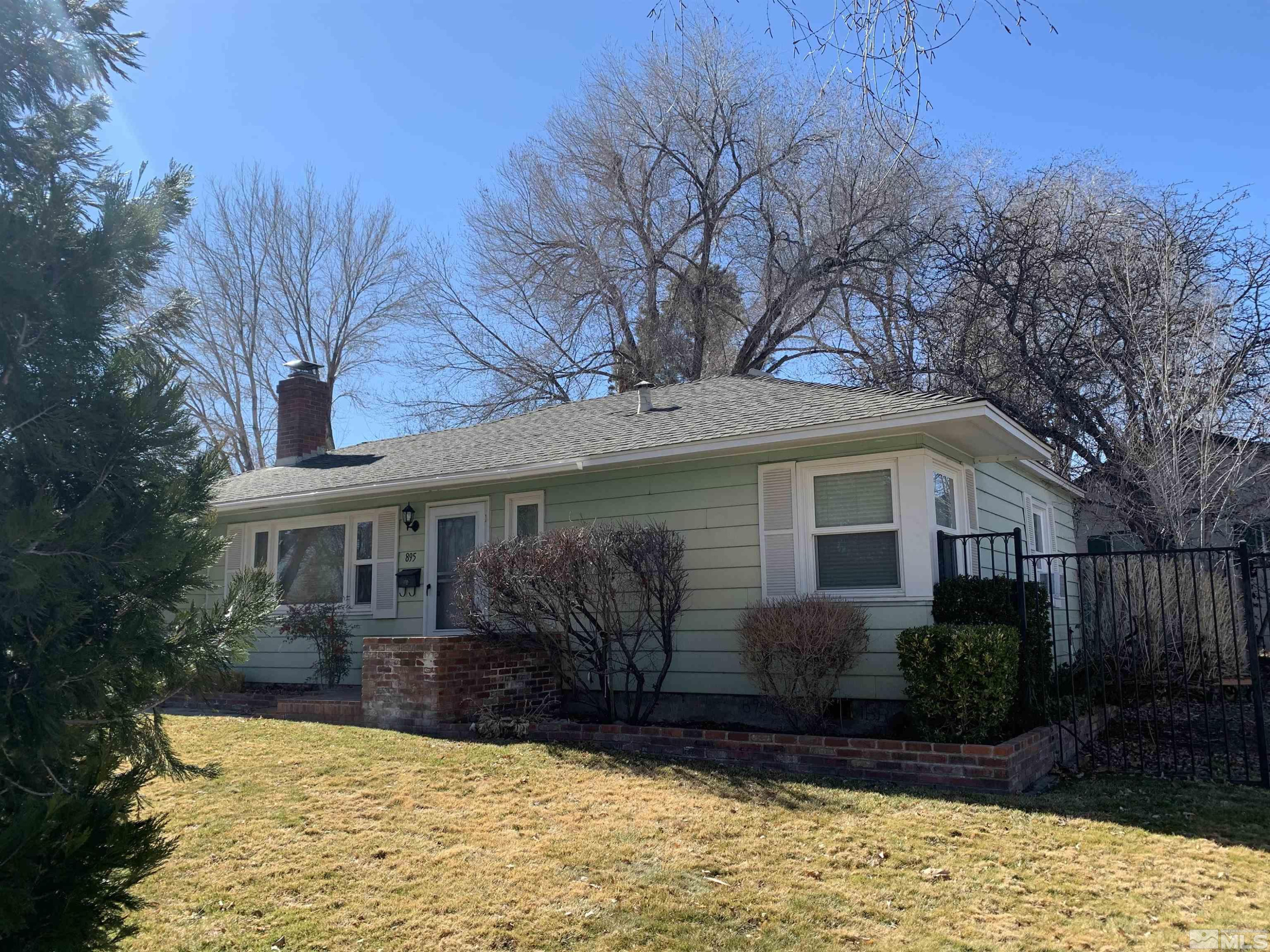 895 Lodge Avenue Reno, NV 89503 - Photo 16 of 28 a front view of a house with a yard