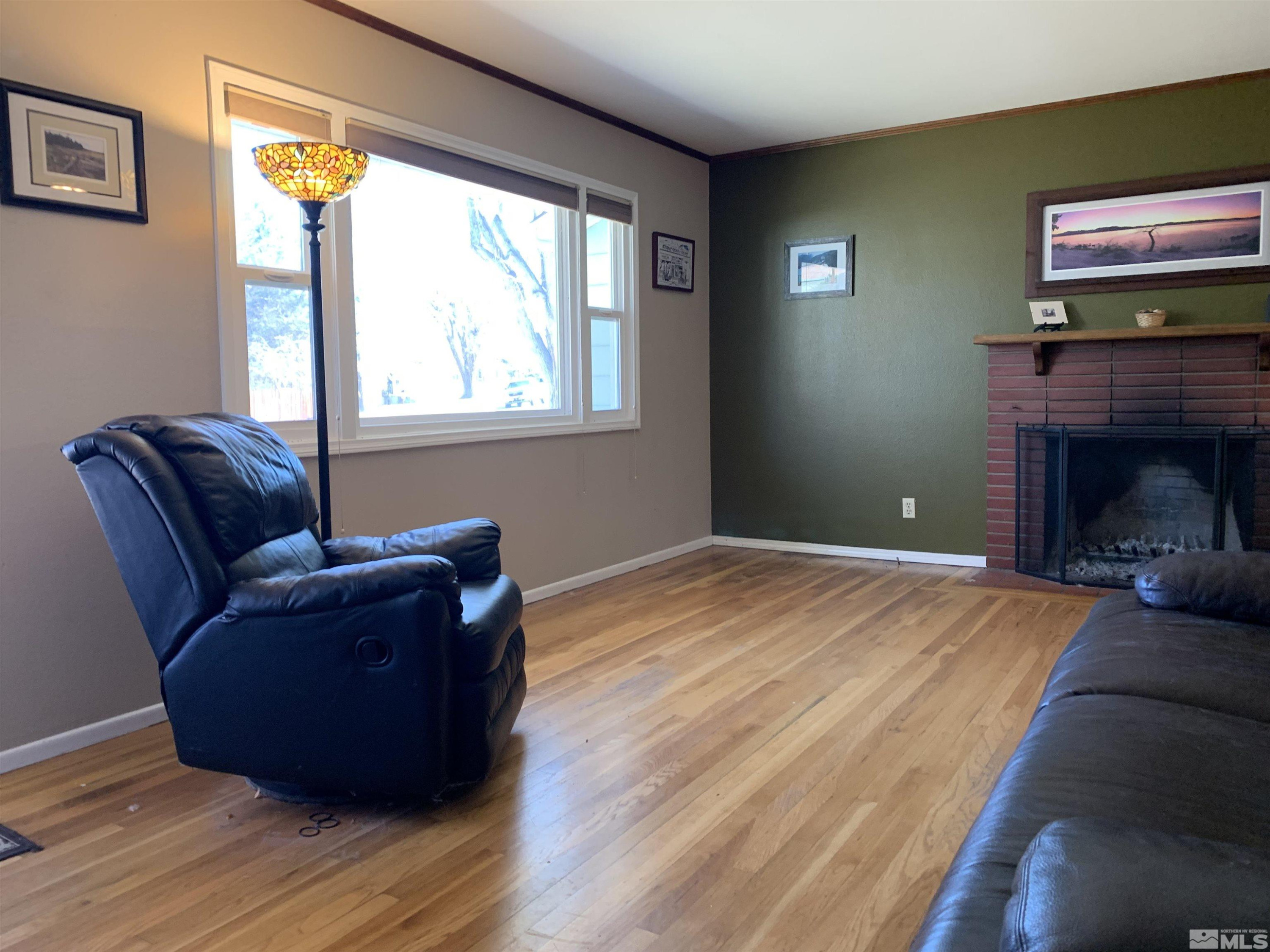 895 Lodge Avenue Reno, NV 89503 - Photo 9 of 28 a living room with furniture and a fireplace