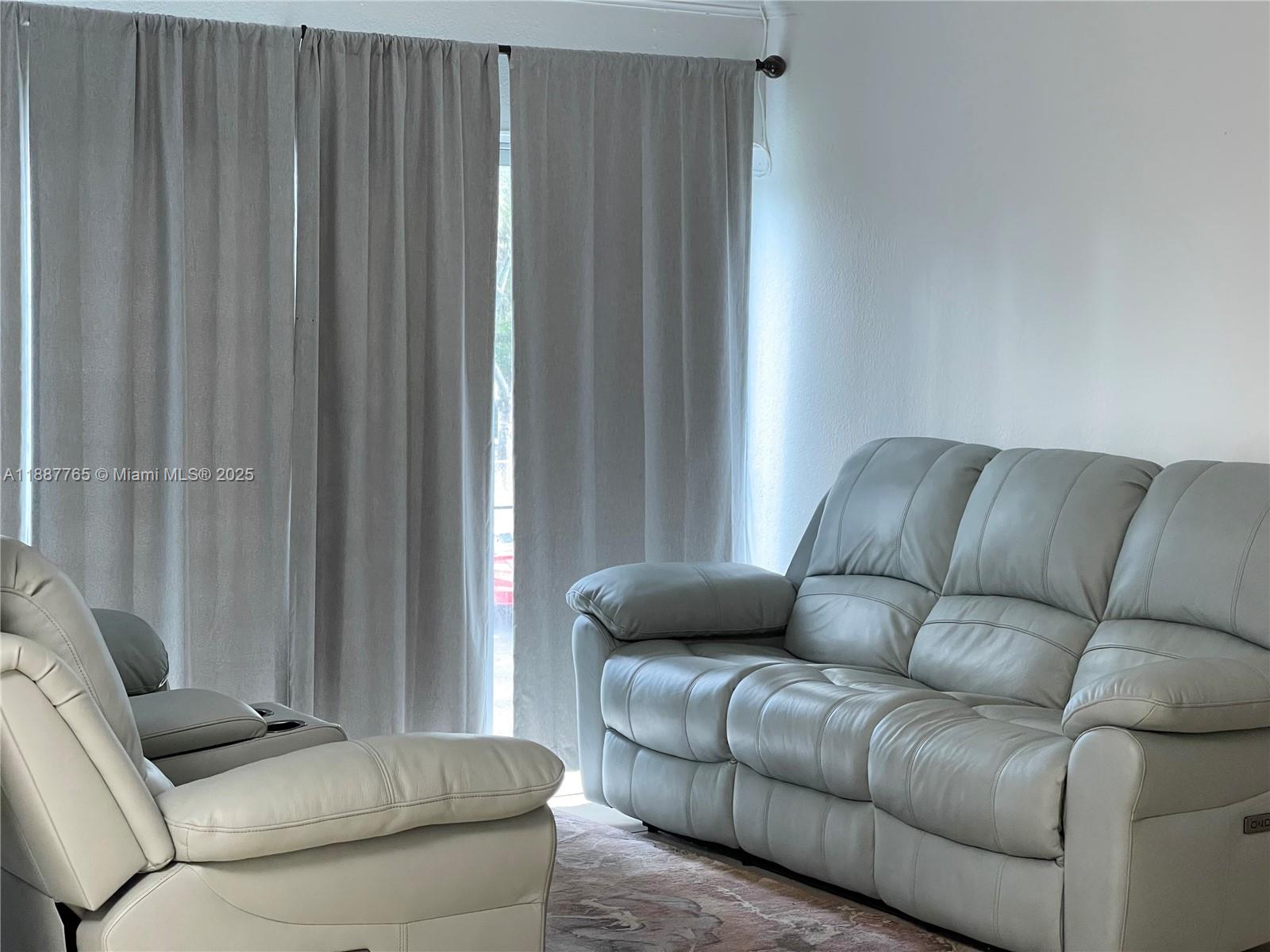 9301 Southwest 4th Street, Unit 224C Miami, FL 33174 - Photo 1 of 19 a living room with furniture and a window