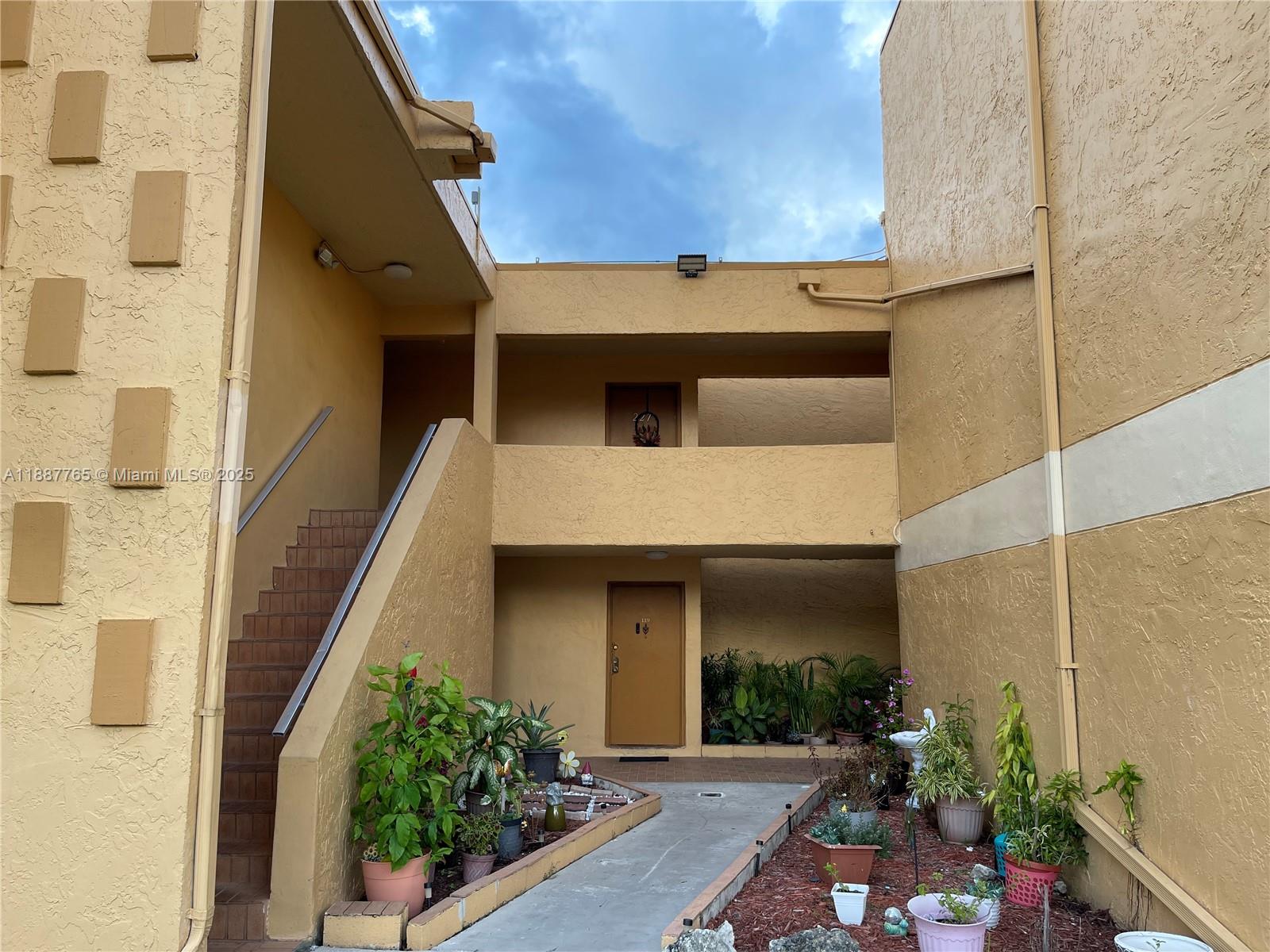 9301 Southwest 4th Street, Unit 224C Miami, FL 33174 - Photo 15 of 19 a view of a house with a potted plant