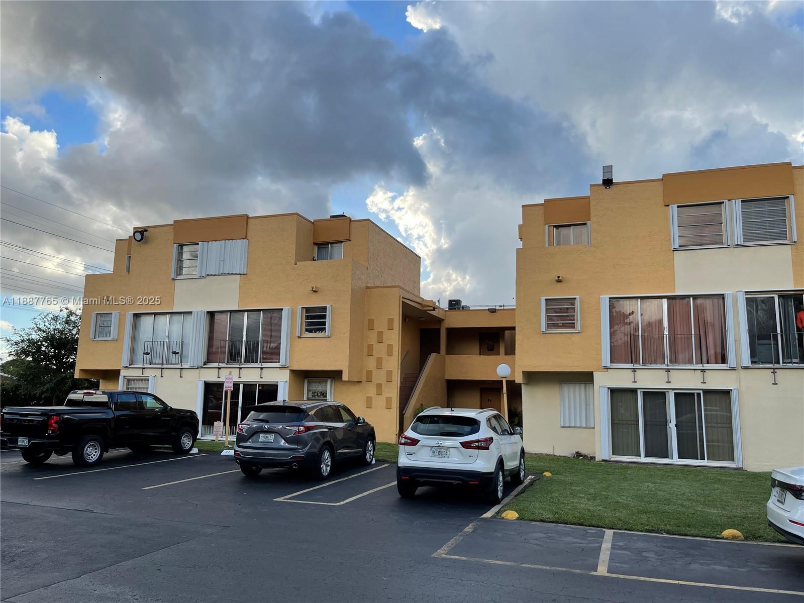 9301 Southwest 4th Street, Unit 224C Miami, FL 33174 - Photo 16 of 19 a car parked in front of a building