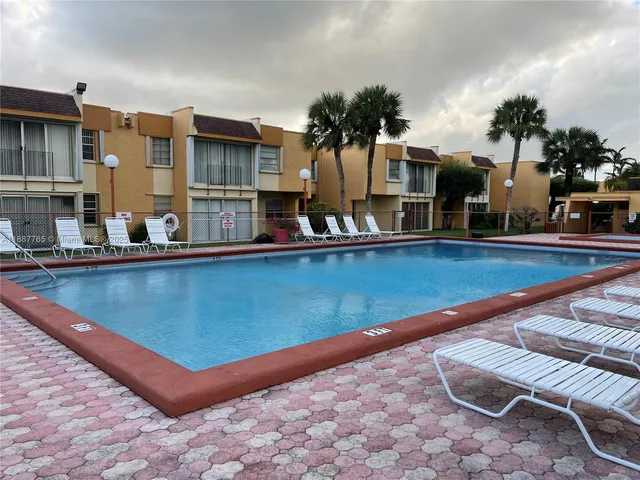 a view of a building with a swimming pool