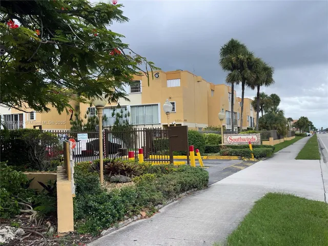 a view of a park with swings and slides