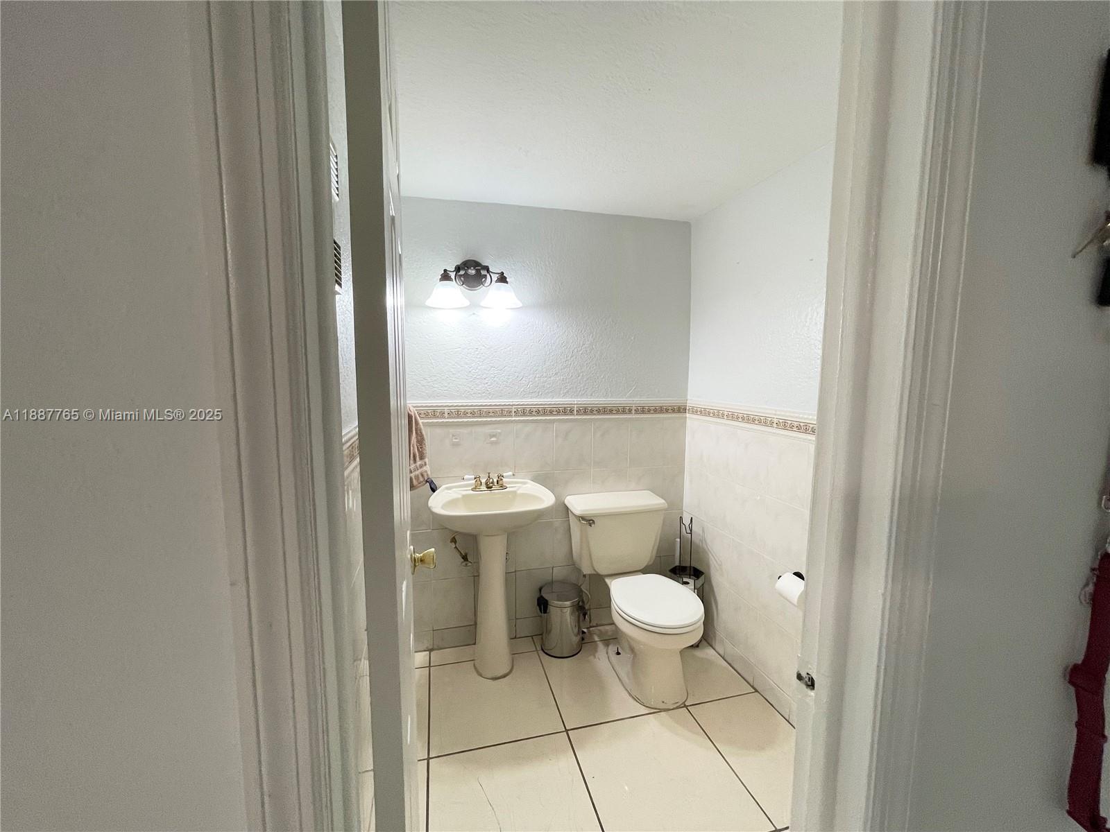 9301 Southwest 4th Street, Unit 224C Miami, FL 33174 - Photo 5 of 19 a bathroom with a toilet and a shower