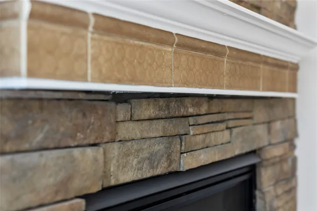 a view of a hallway with wooden floor and entryway