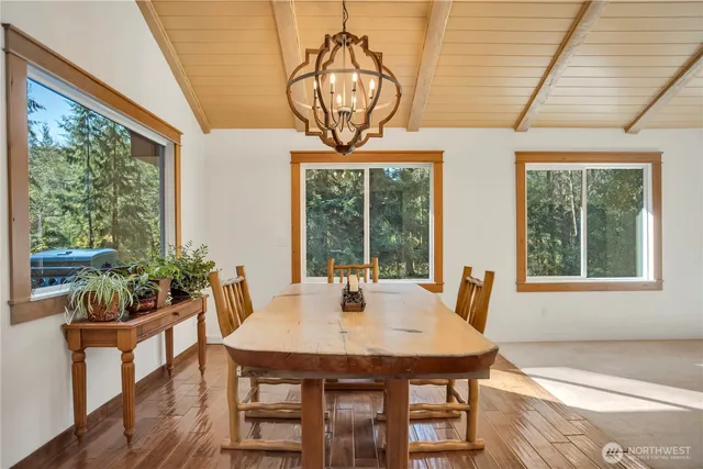 a view of a dining room with furniture window and outside view