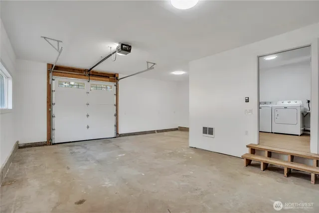a view of a room with gym equipment and a table