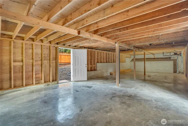 a view of empty room with wooden ceiling