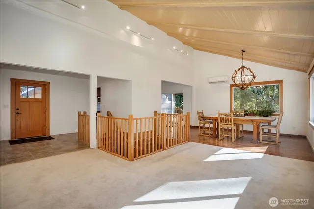 a dining room with furniture and a window