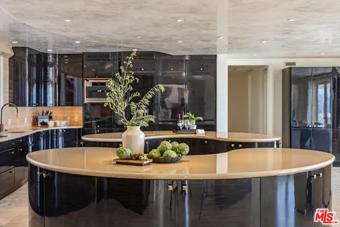 a kitchen with a table and chairs in it