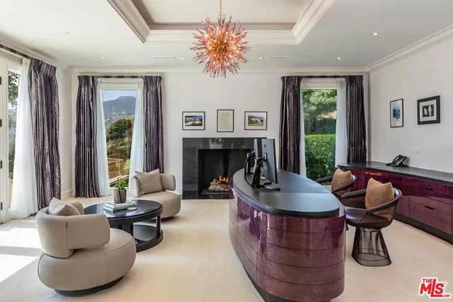 a spacious bedroom with a large bed and a large window