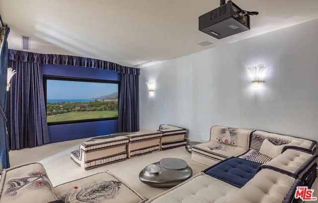 a bathroom with a granite countertop sink a toilet and a shower