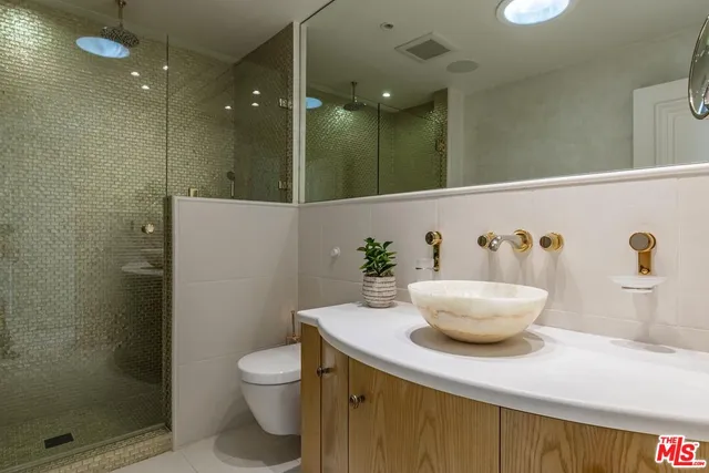 a living room with furniture a chandelier and a fireplace