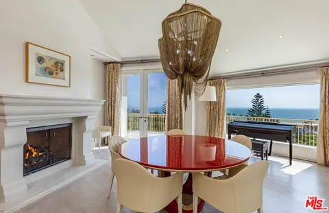 a living room with furniture a rug and a flat screen tv