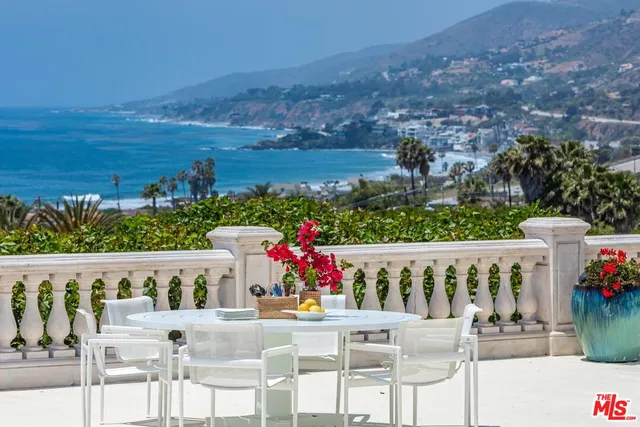 a view of a chairs and table on the terrace