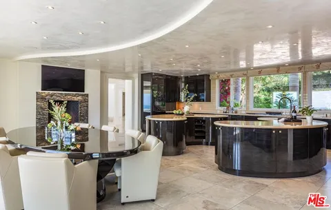 a kitchen with a sink and stove