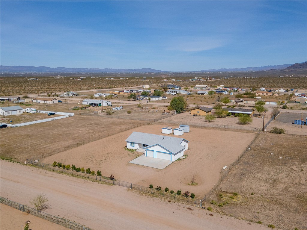 3411 West Carmichael Road Golden Valley, AZ 86413 - Photo 88 of 97 Overview of rural landscape with nearby suburban area and a mountain backdrop