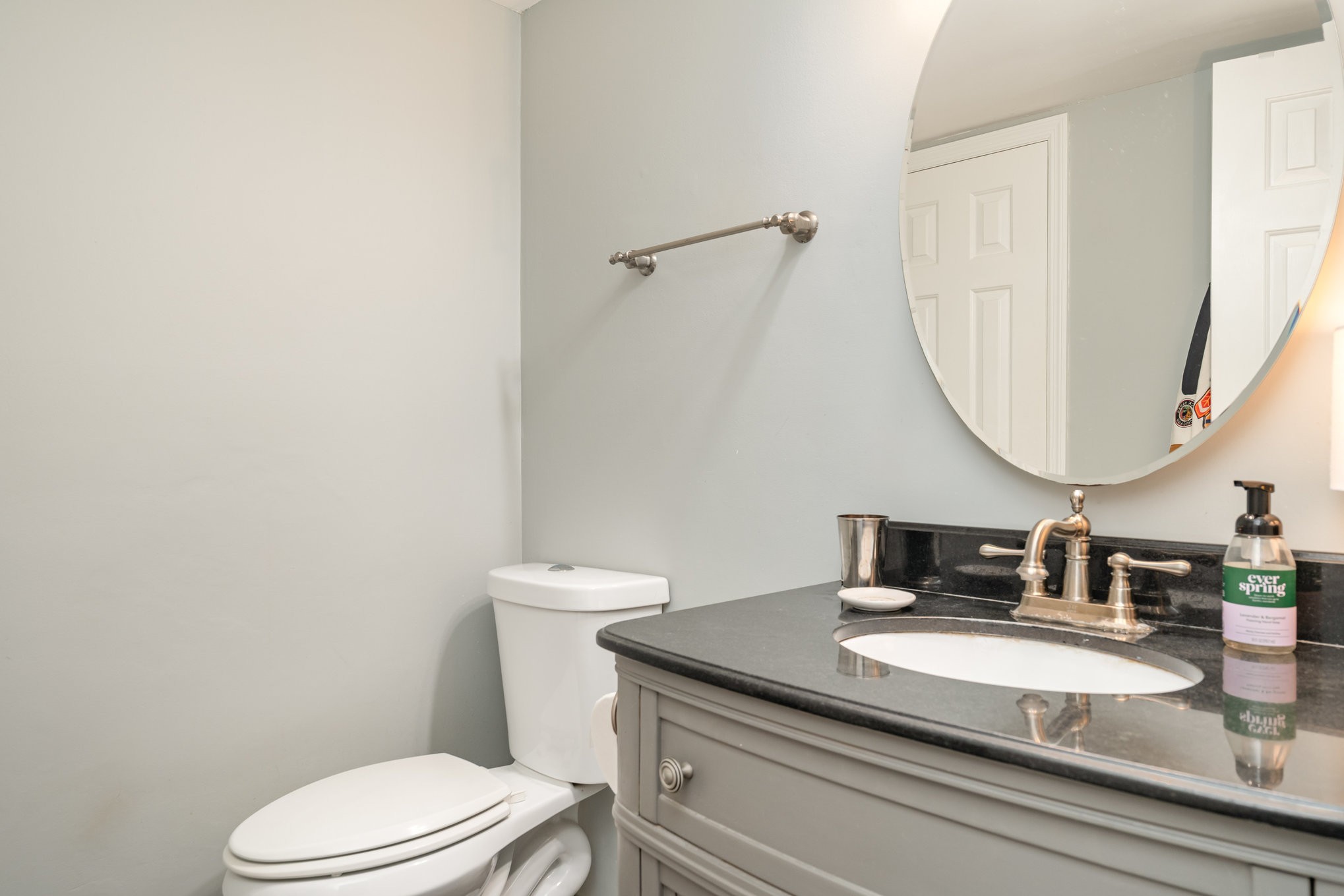 4001 Anderson Road, Unit B124 Nashville, TN 37217 - Photo 14 of 36 a bathroom with a granite countertop sink mirror vanity and toilet