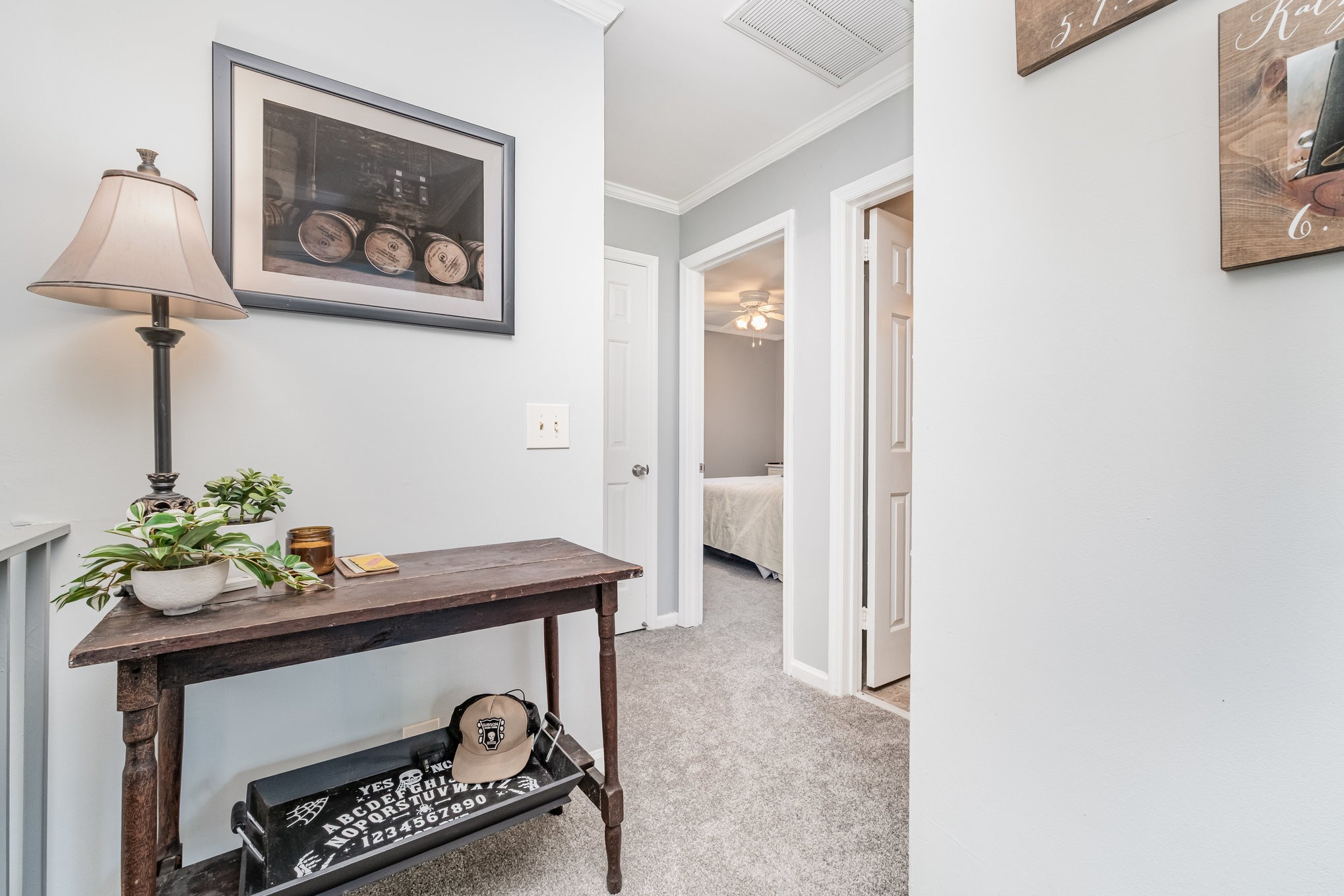 4001 Anderson Road, Unit B124 Nashville, TN 37217 - Photo 23 of 36 a table with a vase and a lamp on it