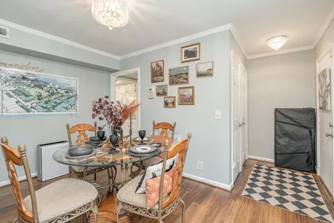 a dining room with furniture and window