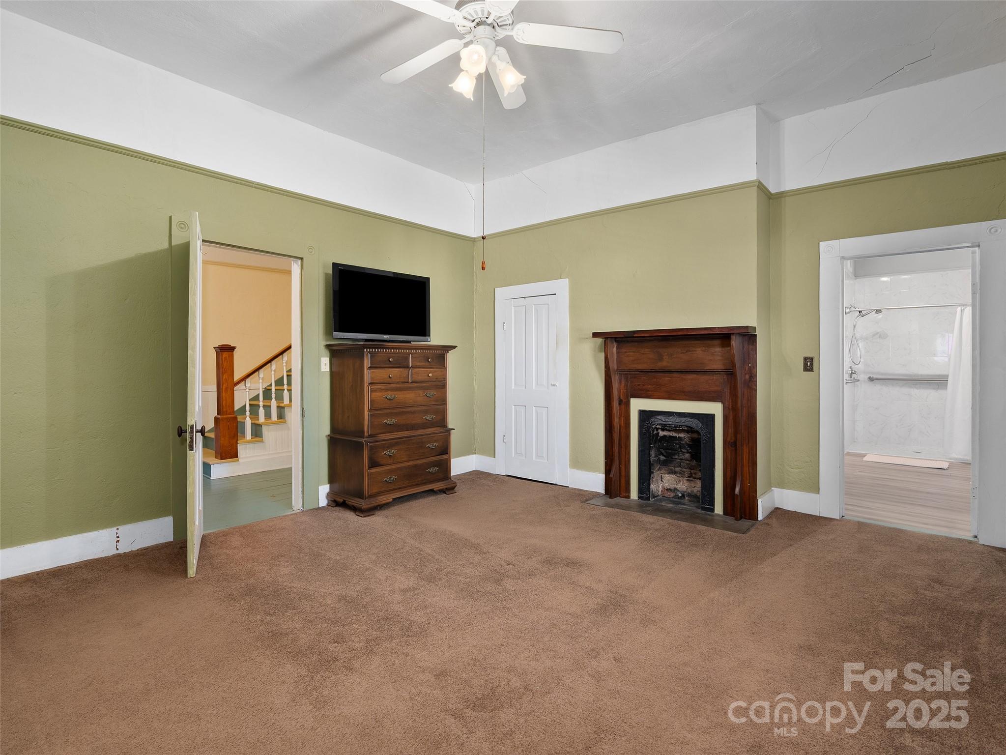 4739 Old Clyde Road Clyde, NC 28721 - Photo 15 of 35 a view of an empty room with a fireplace and a window