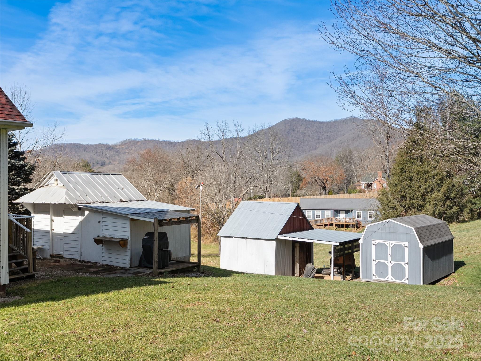 4739 Old Clyde Road Clyde, NC 28721 - Photo 31 of 35 a view of house with a big yard