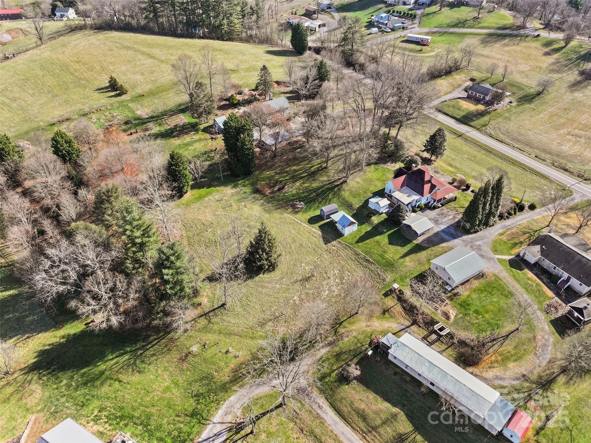 4739 Old Clyde Road Clyde, NC 28721 - Photo 35 of 35 an aerial view of a house with a yard