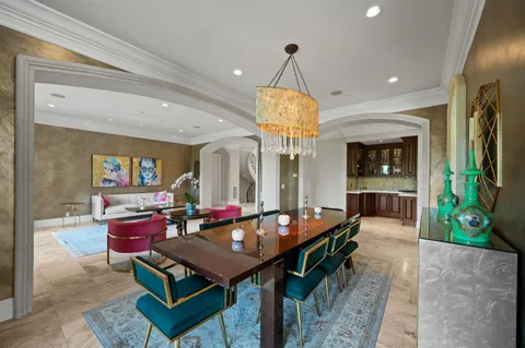 a living room with furniture window and wooden floor