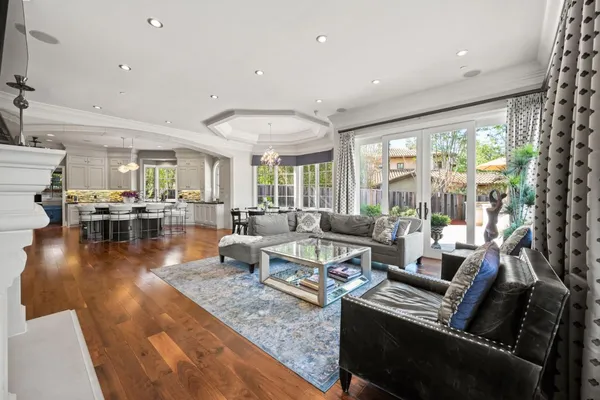 a spacious bathroom with a tub shower and windows