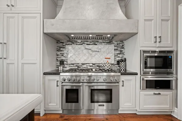 a living room with furniture and large windows